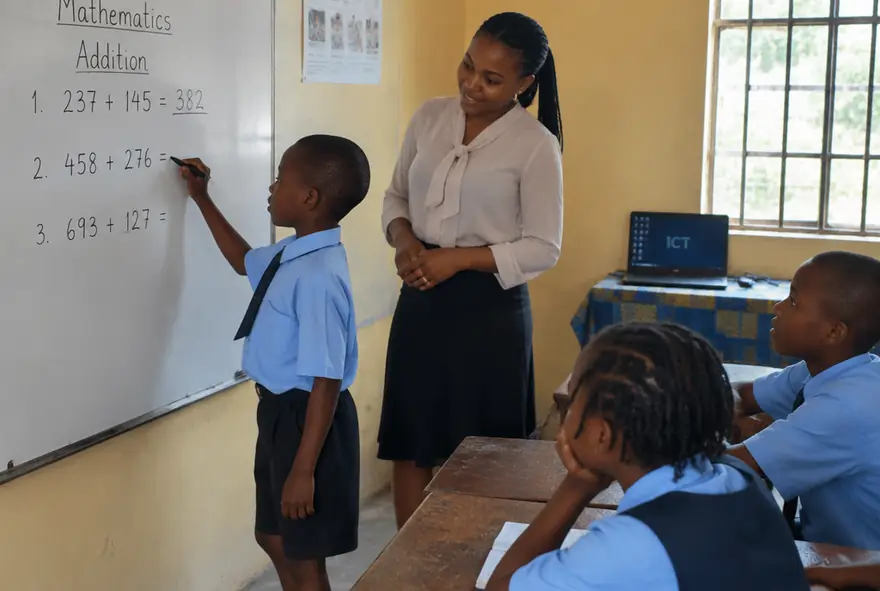Pupils working through a mathematics lesson with hands-on materials